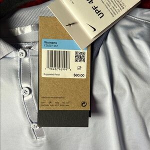 Nike Women's Sky Blue Polo Shirt. Women’s Nike dry fit golf shirt with UPF 40
